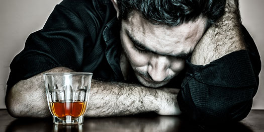 Alcoholic Male with Head on Table