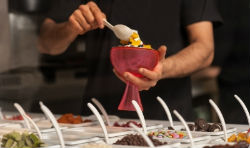 Person getting ice cream from self serve place