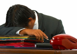 Guy with head on desk