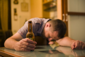 Man Passed Out With A Beer In His Hand