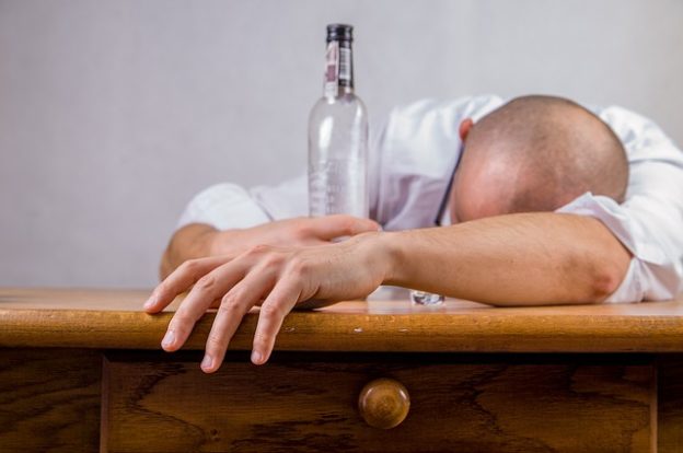 Man in Denial About His Addiction Passed Out At A Bar - Addiction Hope