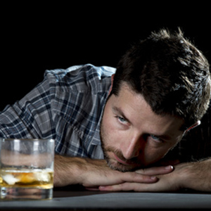 Man Sitting At A Bar In Denial About His Addiction - Addiction Hope