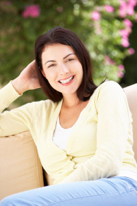 Woman in Addiction Recovery Relaxing On Sofa At Home