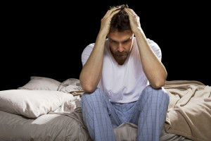 Man sitting on bed thinking about Recovery