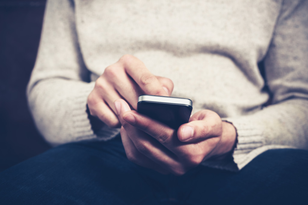 Man Using A Smartphone for Online Counseling