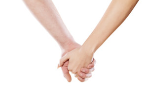 male and female hand holding each other