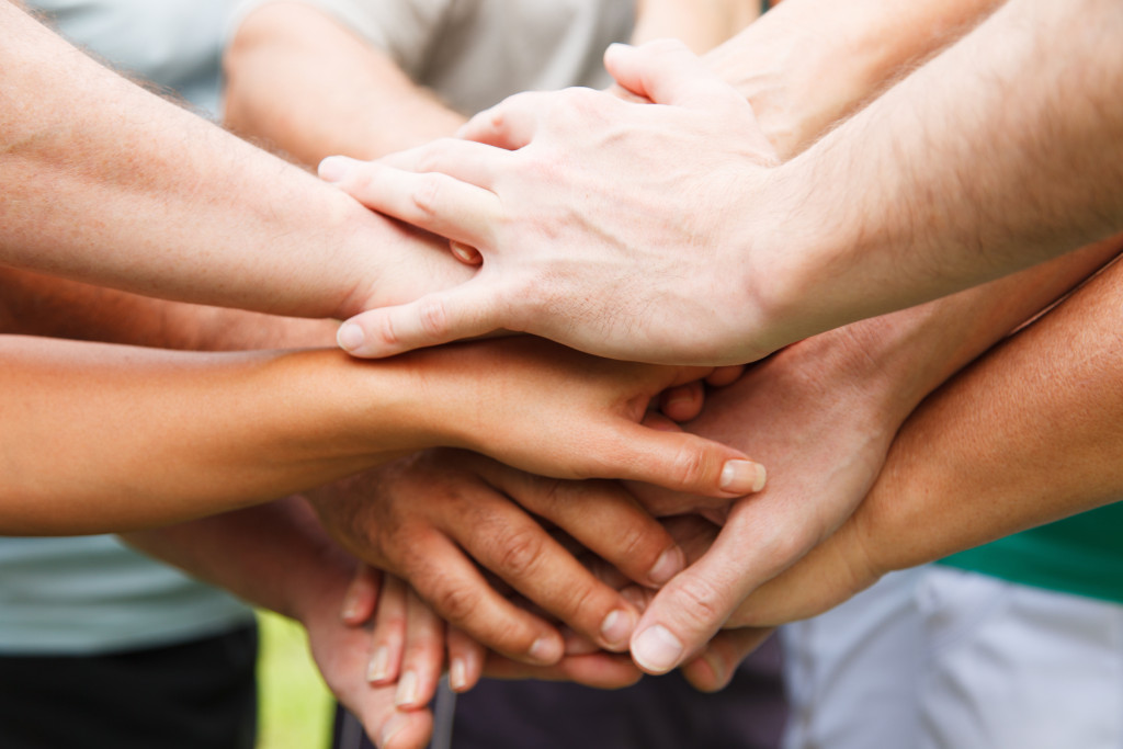 Stack of hands - real people agreement