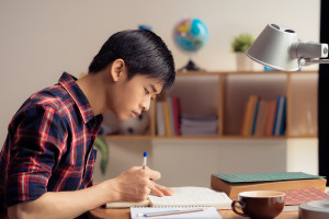 Young asian man studying about drug abuse