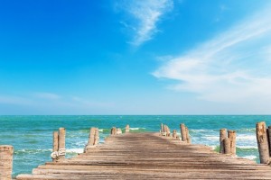 Wooden jetty with blue sky