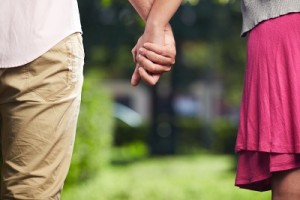 man and woman holding hands