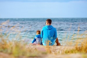 father and son together near the seaside