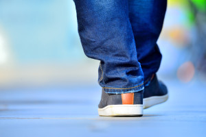 Close up of person walking on street