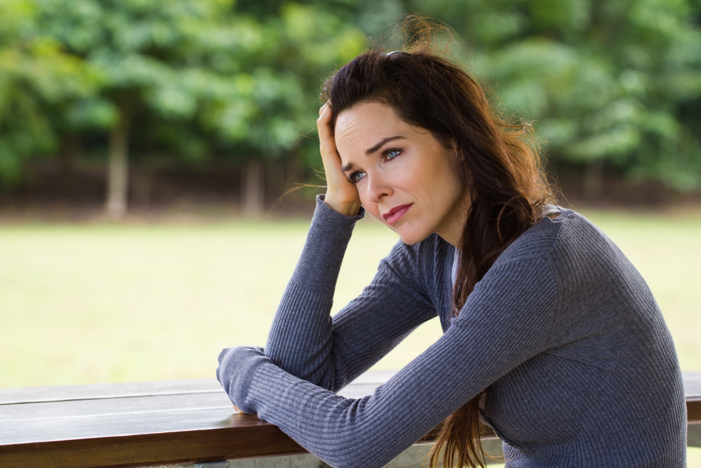 Woman contemplating her Chronic Kidney Disease