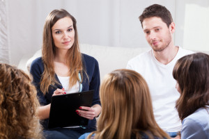 Group of young people during psychotherapy, horizontal