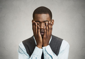 Portrait, headshot Depressed sad man, grey wall background