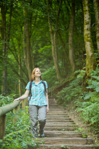 Girl hiking through forest