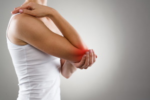 Woman suffering from chronic joint rheumatism