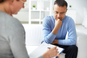 Man sharing problems with psychologist