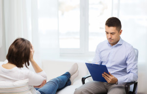 doctor and young woman meeting at home visit