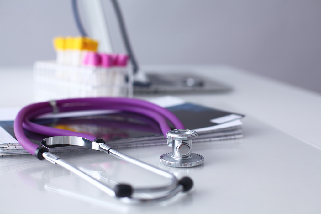 Medical document and test tube with stethoscope .