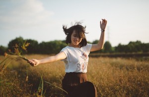 girl in field dancing