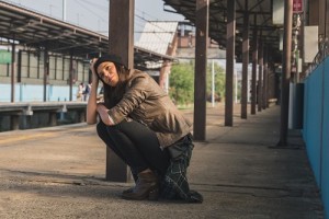 Pretty girl posing in a metro station