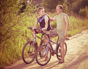 The father with the son on bicycles,with a retro effect