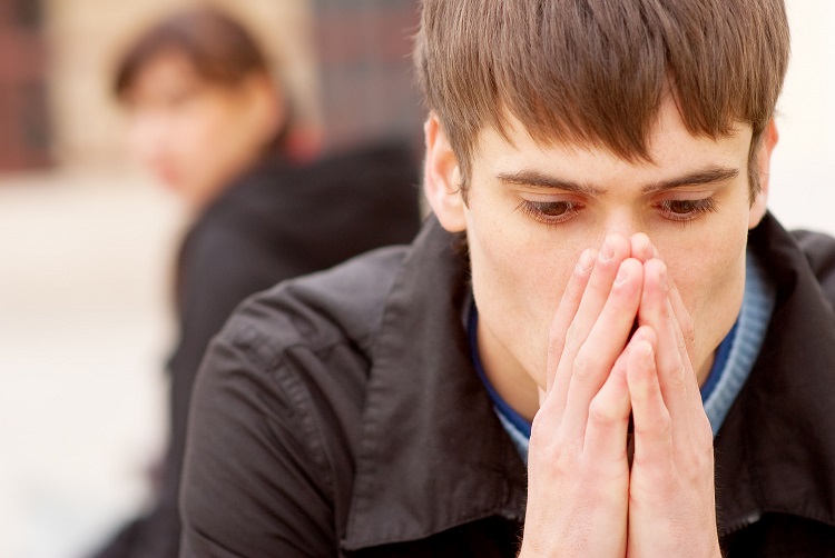 Boy With Head In His Arms Suffering From Asthma - Addiction Hope