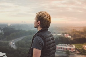 Guy looking at the shy and thinking about the significant changes in life