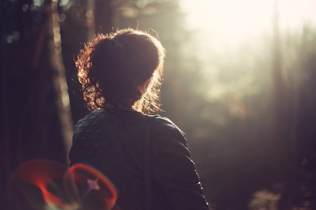 lady sitting forest at sunset