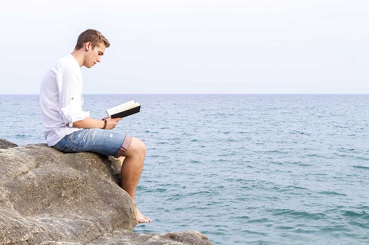 man reading Bible