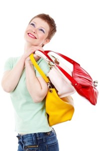 Lady Smiling with 3 Purses on Shoulder