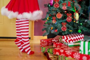 Woman decorating the Christmas tree and dealing with Anxiety