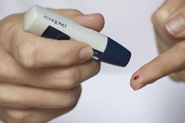 Diabetic woman testing her blood.