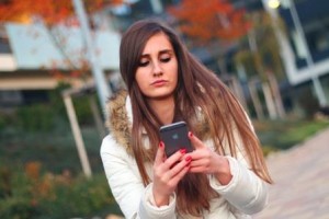 Young woman looking at Google on her phone