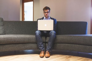 Man researching steroid therapy on his laptop.