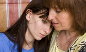 Mother Consoling Daughter wit a Substance Use Disorder