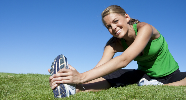 Young Woman Stretching Outside - Addiction Hope