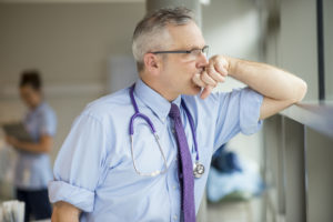 exhausted doctor fighting the OUD Epidemic