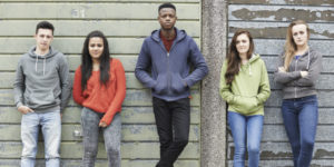 Group Of Male And Female Teenagers Not Smiling - Addiction Hope