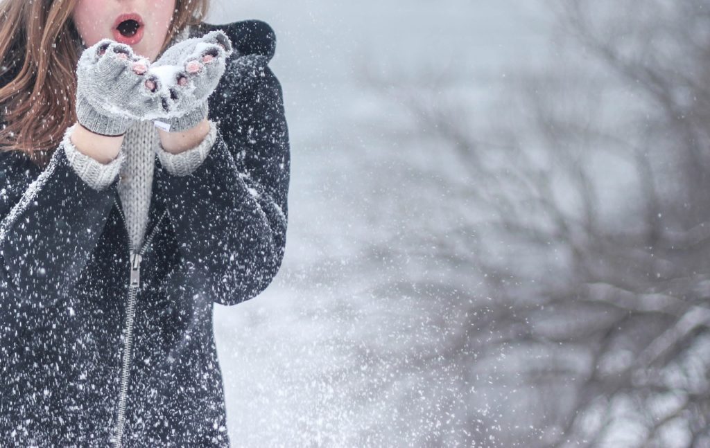 Woman playing in the snow