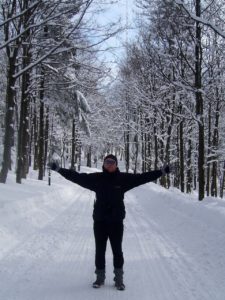 Man with arms wide in snow