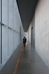 Man in recovery walking down hallway