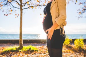 Pregnant woman in the fall