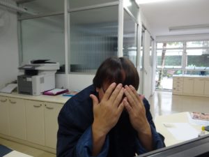 Man full of shame with his head in his hands