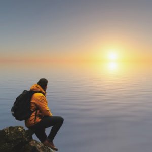 Man choosing a program by the sea