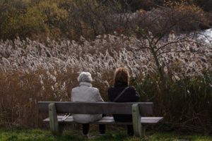 Mother daughter on a bench