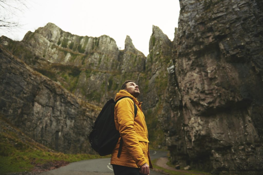 Personality types of a man looking at cliffs and adventurous