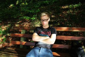 Boy sitting on a bench