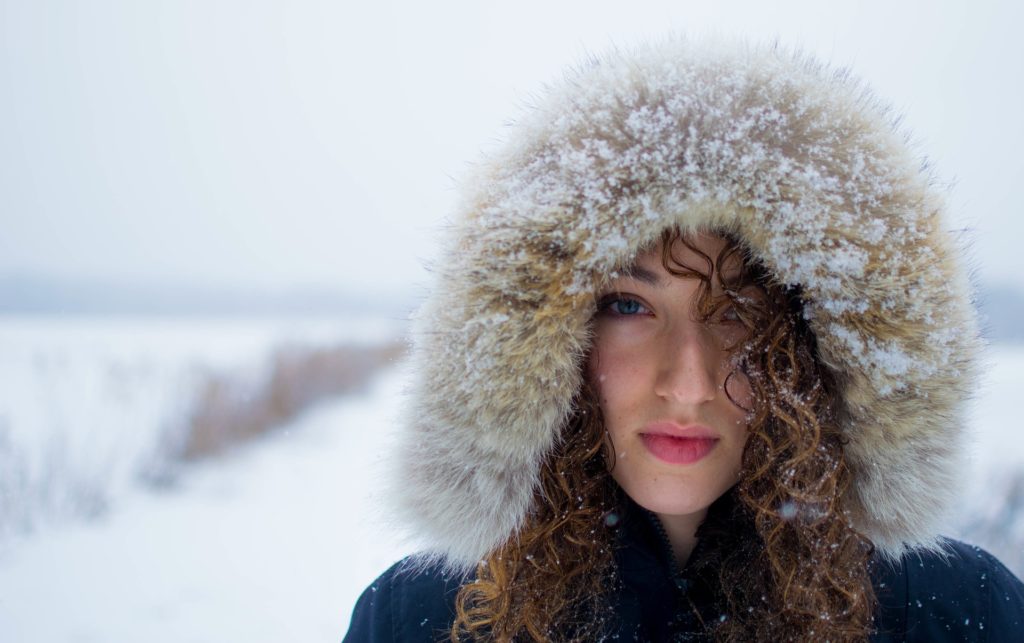 Woman in fur hat struggling with cocaine addiction in women